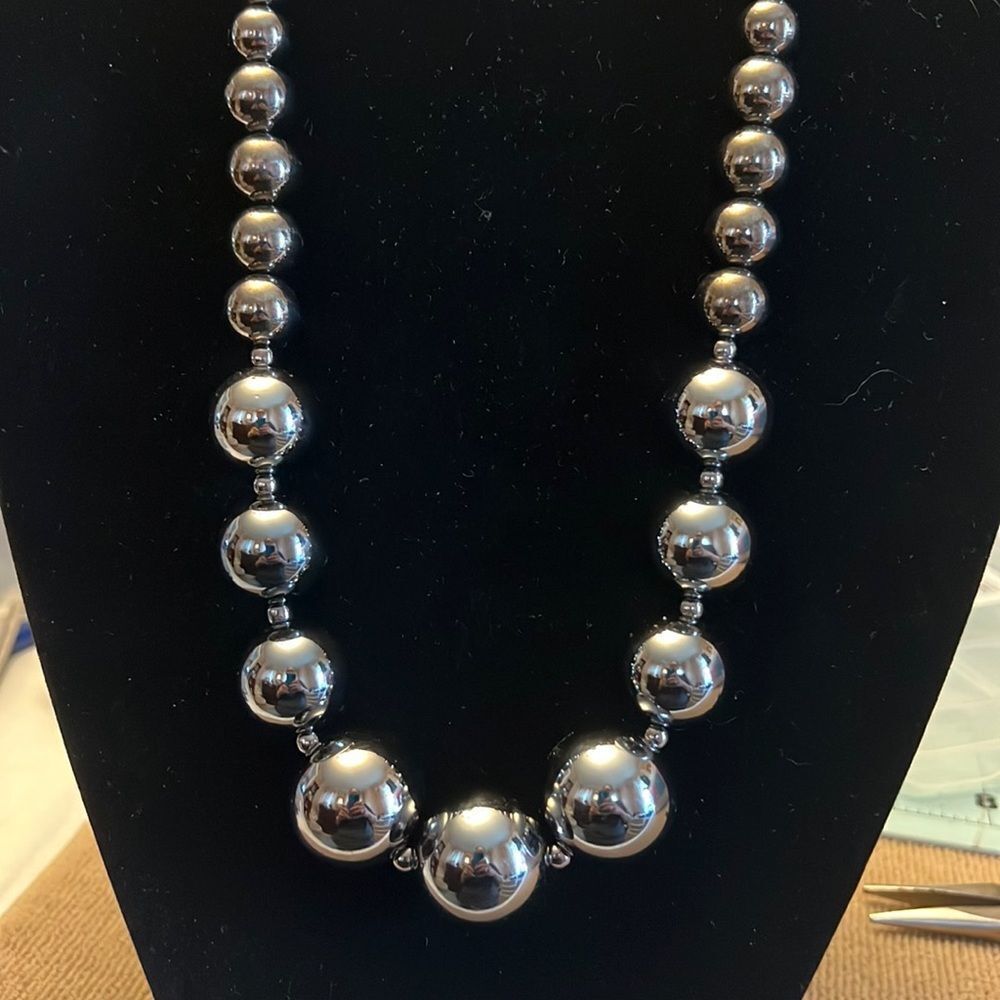 Shiny Black beaded necklace. Total len. approx 21 inches plus built in Extender